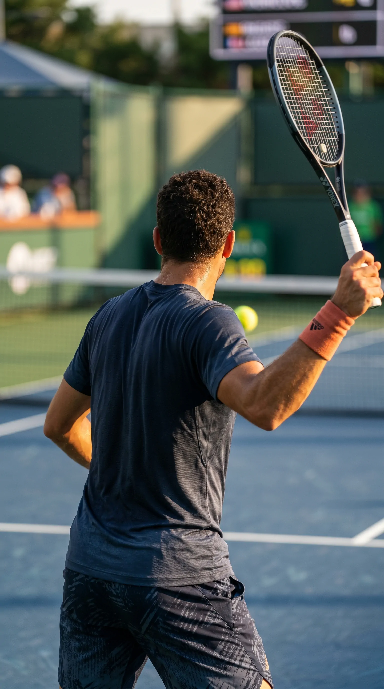 Player following through on a blue hard court
